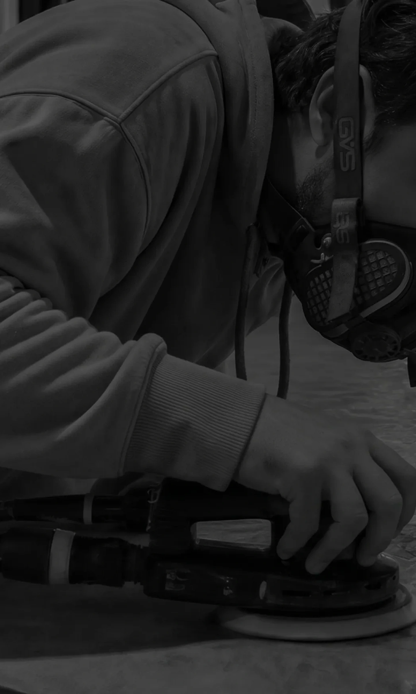 Artisan hand-finishing a microcement piece